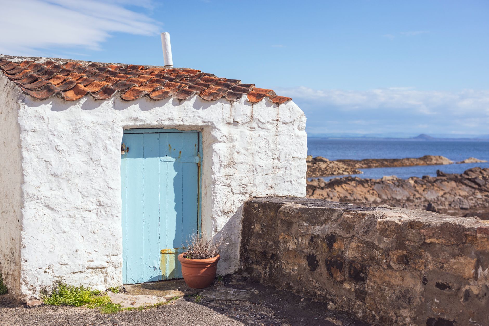 A coastal self-catering holiday cottage managed remotely by an absentee owner